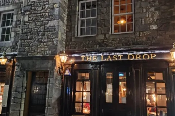 The Last Drop pub in Edinburgh's old town, windows lit at dusk