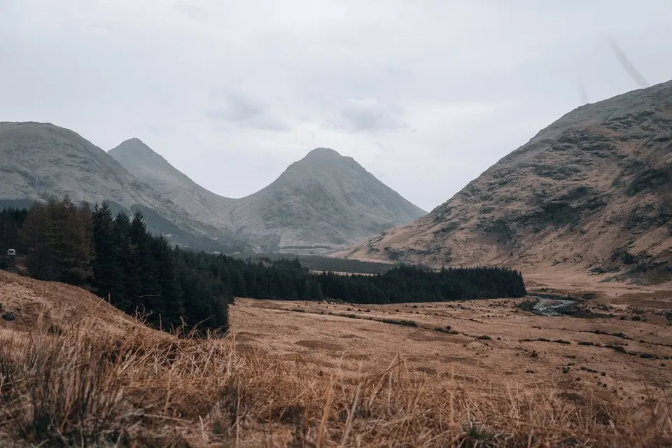 The cone-shaped Buachaille Etive peaks at the head of the glen