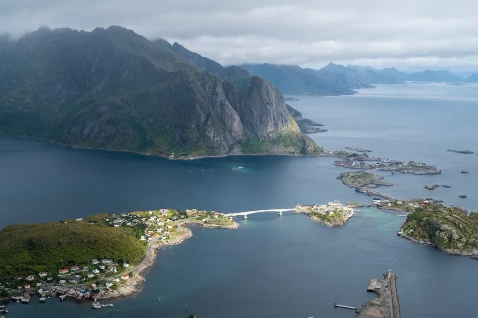 A wide view over Reine with the bridge across the fjord